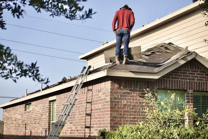 Professional roofer working on a residential roof in Geigertown